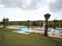 Yellow complex and swimming pool on site